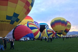 A row of balloons are prepped for flight. (WTOP/Noah Frank)