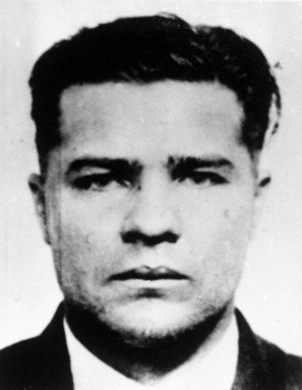 **ADVANCE FOR MONDAY FEB 2** Charles "Pretty Boy" Floyd is shown in this 1932 photo, location not known. On the centennial of  Floyd's birth, the notorious bank robber and mass murderer is still remembered as a Robin Hood in his home states of Oklahoma and Arkansas, celebrated in pop culture and credited with bringing the FBI to prominence.  Floyd is immortalized in gangster lore and FBI records for the Kansas City Massacre of June 17, 1933, when he and another man shot two Kansas City police officers,two FBI agents and Frank Nash, a criminal Floyd was trying to spring from federal custody. (AP Photo/file)