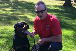 David Thorne with Neeko the Rottweiler from the Calvert K-9 search and rescue team. (WTOP/Mike Murillo)