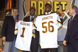 LaVar Arrington, second from right, the second pick of the NFL draft, stands with Chris Samuels, second from left, who was the third pick of the draft, Saturday, April 15, 2000 in New York. Both playes were taken by the Washington Redskins. On the left is NFL Commissioner Paul Tagliabue and Redskins co-owner Fred Drasner is on the right. (AP Photo/Ed Betz)