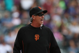 DENVER, CO - APRIL 23:  Bench coach Ron Wotus #23 of the San Francisco Giants takes over for manager Bruce Bochy #15 of the San Francisco Giants after Bochy was ejected against the Colorado Rockies at Coors Field on April 23, 2014 in Denver, Colorado. The Giants defeated the Rockies 12-10 in 11 innings.  (Photo by Doug Pensinger/Getty Images)