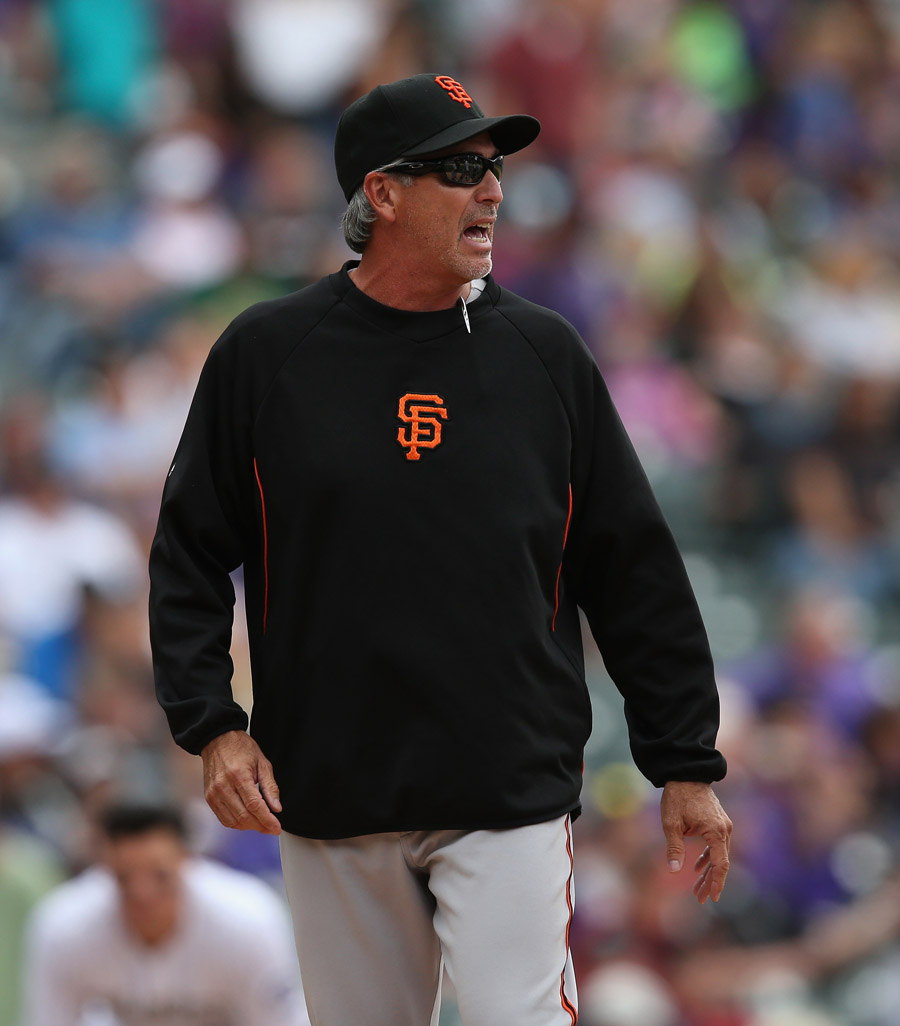 DENVER, CO - APRIL 23:  Bench coach Ron Wotus #23 of the San Francisco Giants takes over for manager Bruce Bochy #15 of the San Francisco Giants after Bochy was ejected against the Colorado Rockies at Coors Field on April 23, 2014 in Denver, Colorado. The Giants defeated the Rockies 12-10 in 11 innings.  (Photo by Doug Pensinger/Getty Images)