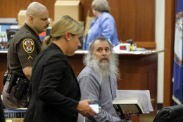 Charles Severance looks toward his parents (out of picture) as he is wheeled from the courtroom for a break at the trial for alleged Alexandria serial killer at the Fairfax County Circuit Court on Wednesday, October 14, 2015.  He is accused of three murders over a 12 year period, believed to be revenge against the Alexandria court system and the citizens of the city.  
(Pool Photo by Jahi Chikwendiu/The Washington Post)