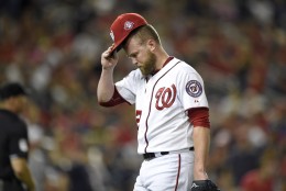 Washington Nationals relief pitcher Drew Storen walks off the field to the dugout after the top of the eighth inning of a baseball game against the Colorado Rockies, Friday, Aug. 7, 2015, in Washington. (AP Photo/Nick Wass)