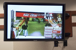 An image of a person of interest, that the prosecution claims is Charles Severance, is shown leaving a Target store the day Nancy Dunning was murdered, Friday, Oct. 16, 2016, at the Fairfax County Circuit Court  in Fairfax, Va.  Severance is accused of three murders over the course of a decade in Alexandria, Va. (AP Photo/Evan Vucci, Pool)