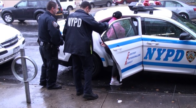 Photo of Erica Ufie being arrested in New York City