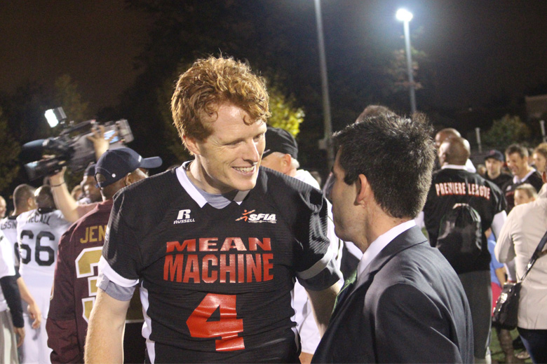 Mean Machine # 4 Joe Kennedy Jr. greets a fan after the game. (WTOP/Dana Gooley)