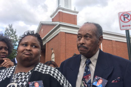 A new street sign unveiled at New Samaritan Baptist Church in D.C. was named for the late Ruby Whitfield, who was struck and killed by a motorist while leaving the church in 2013. Her daughter, Tasha Whitfield, and husband, Thomas Whitfield, attended an official ceremony at the church Sunday, Oct. 18, 2015. (WTOP/Dick Uliano)