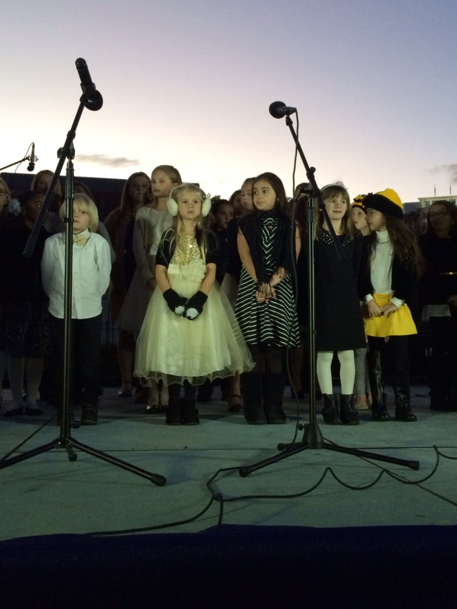 As the sun set,  children from Studio Bleu in Ashburn,  Va., sang "Beautiful" by Christina Aguilera. 