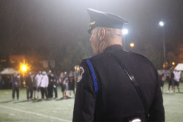 An MPD officer watches the opening ceremony. (WTOP/Dana Gooley)