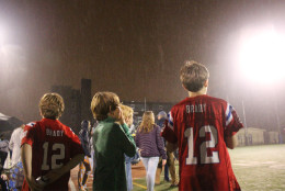 Despite the bad weather, fans young and old came out to support the teams. (WTOP/Dana Gooley)