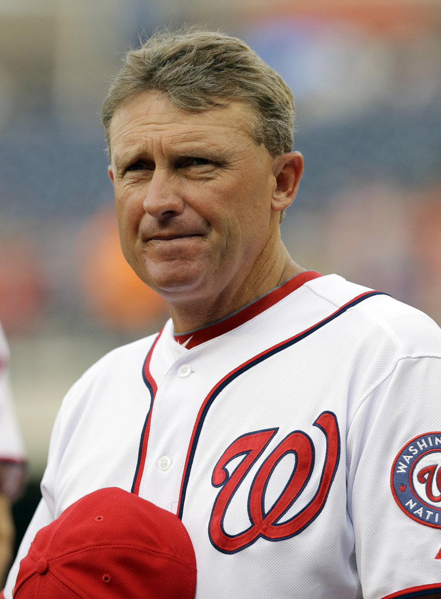 Washington Nationals bench coach Randy Knorr (53) stands during the National Anthem before a baseball game against the San Francisco Giants at Nationals Park Tuesday, Aug. 13, 2013, in Washington. (AP Photo/Alex Brandon)