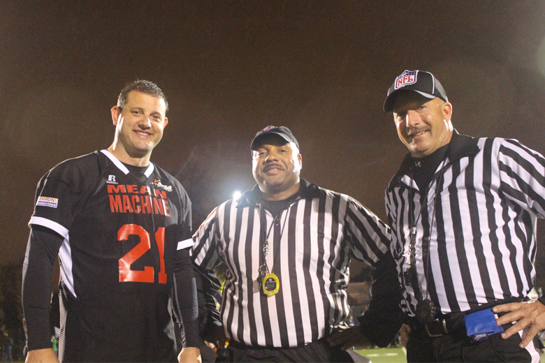 Mean Machine # 21 David Valadao, R-CA, poses with two referees. (WTOP/Dana Gooley)
