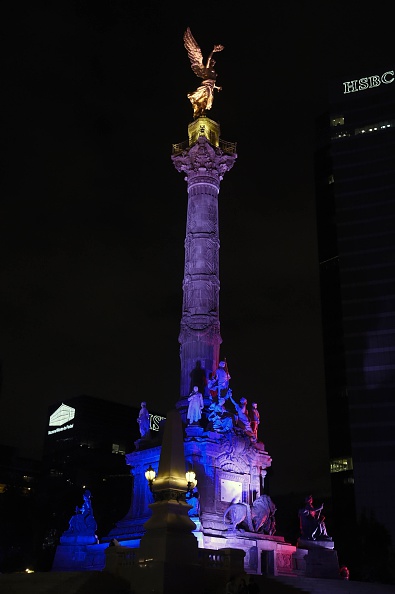 Mexican Independence Angel square is illuminated with the red, white and blue colors of the French national flag in solidarity with France on November 13, 2015, in Mexico City, after attackers killed at least 120 people in Paris. AFP PHOTO/ ALFREDO ESTRELLA        (Photo credit should read ALFREDO ESTRELLA/AFP/Getty Images)