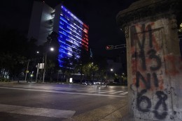 The Mexican Senate building is illuminated with the red, white and blue colors of the French national flag in solidarity with France on November 13, 2015, in Mexico City, after attackers killed at least 120 people in Paris. AFP PHOTO/ALFREDO ESTRELLA        (Photo credit should read ALFREDO ESTRELLA/AFP/Getty Images)