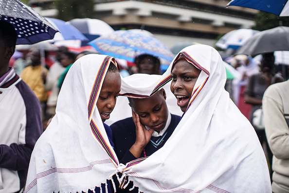 NAIROBI, KENYA - NOVEMBER 26: Schoolgirls attend a mass delivered by Pope Francis at the University of Nairobi grounds on November 26, 2015, in Nairobi, Kenya. Pope Francis makes his first visit to Kenya on a five day African tour that is scheduled to include Uganda and the Central African Republic. Africa is recognised as being crucial to the future of the Catholic Church with the continent's Catholic numbers growing faster than anywhere else in the world.  (Photo by Nichole Sobecki/Getty Images)