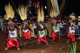 Men dressed in traditional tribal clothes dance during a visit by Pope Francis with the Munyonyo community on November 27, 2015 in Kampala. Pope Francis arrived in Uganda on November 27 on the second leg of a landmark trip to Africa which has seen him railing against corruption and poverty, with huge crowds celebrating his arrival. AFP PHOTO / GIUSEPPE CACACE / AFP / GIUSEPPE CACACE        (Photo credit should read GIUSEPPE CACACE/AFP/Getty Images)