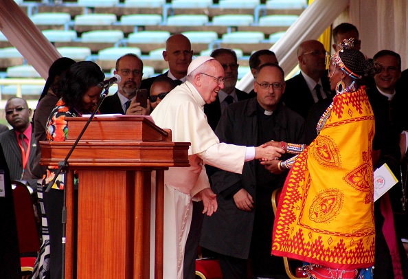 NAIROBI, KENYA - NOVEMBER 27: Pope Francis  shake hands with a woman at the Kasarani Sport Stadium in Nairobi on November 27, 2015. Pope Francis is in an African tour which he will visit Kenya, Uganda and Central African Republic (CAR), countries. (Photo by Stringer/Anadolu Agency/Getty Images)