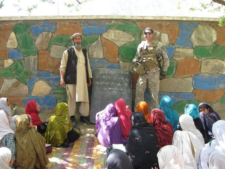 6.	Then-U.S. Army 2nd Lt. Florent Groberg poses during a visit to an all-girls school, where they were learning English, in Kunar Province, Afghanistan, April 2010. (Photo courtesy of Retired U.S. Army Capt. Florent Groberg)