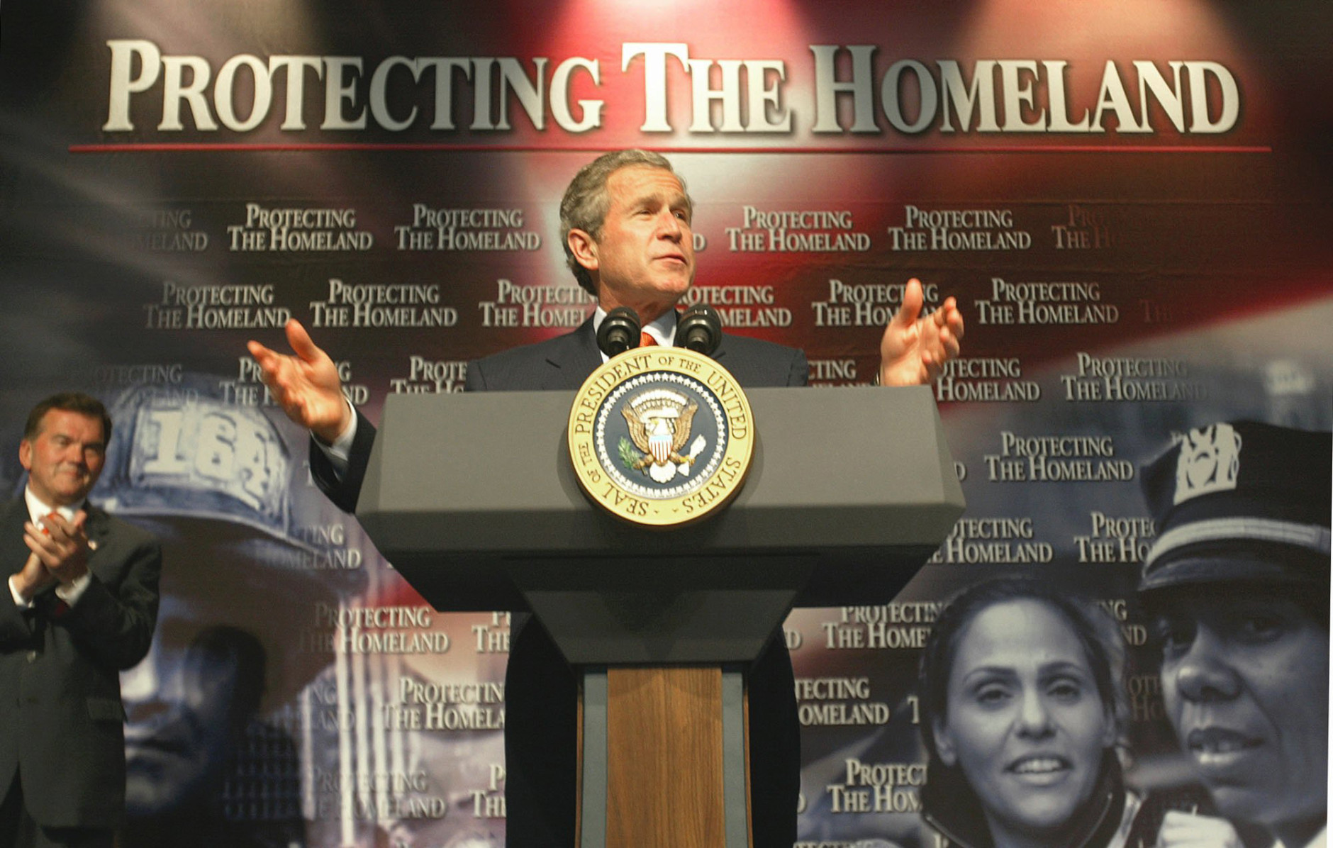 ** FILE ** President Bush makes remarks on Homeland Security at Oak Park High School in Kansas City, Mo., in this June 11, 2002 file photo. The name of the Department of Homeland Security is meant to evoke images of safety, even family, hearth, comfort. It gives some people a knot in the stomach. An uncommon word to begin with, "homeland" became an everyday word after the Sept. 11 attacks and was institutionalized when President Bush created the Office of Homeland Security. (AP Photo/Ron Edmonds, File)