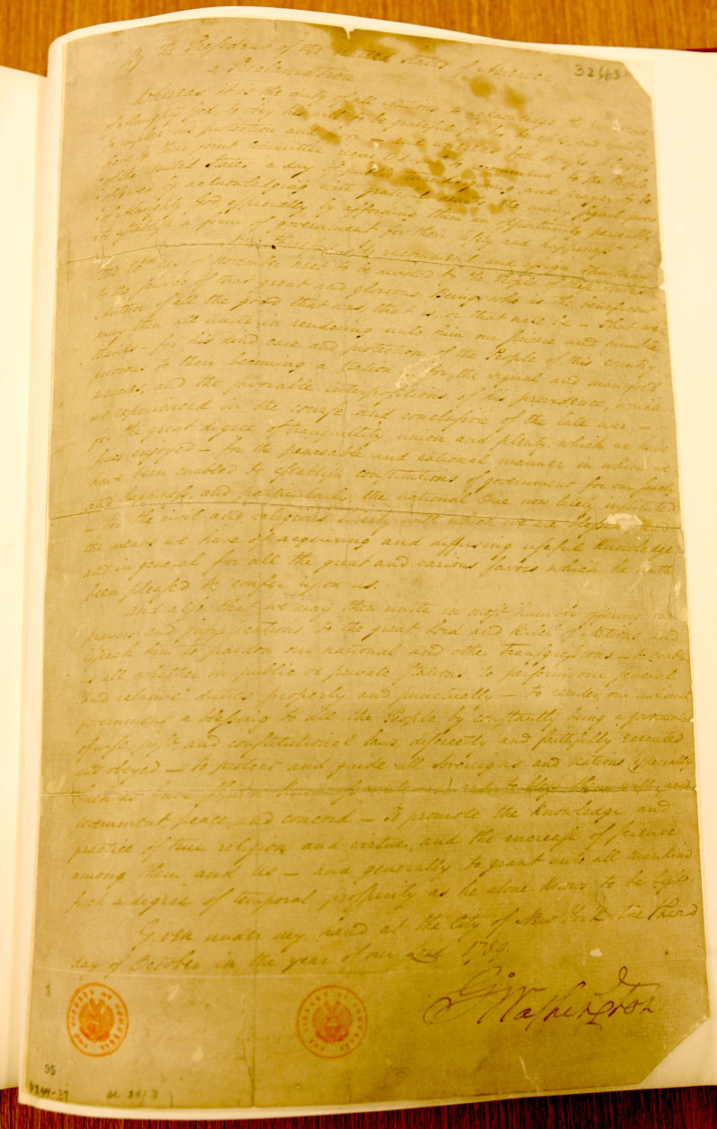 The George Washington Thanksgiving Proclamation, signed and dated Oct. 3, 1789 by George Washington, as seen in the collection of the Library of Congress Tuesday, Nov. 23, 2004.  Resolutions get passed in Congress like bread around the dinner table, so Americans can be forgiven if they've never heard the story of an 18th century New Jersey congressman and his role in getting Thanksgiving recognized by none other than George Washington. The history lesson usually ends there, but 168 years after the first Thanksgiving dinner, Congressman Elias Boudinot of Burlington, N.J., played a significant role in forming the holiday as it's known today. On Sept. 25, 1789, Boudinot introduced a resolution in the House of Representatives requesting the president to declare a national day of public thanksgiving. (AP Photo/Charles Dharapak)