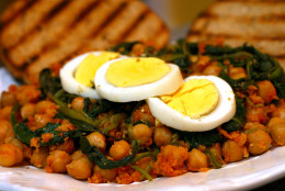 ** FOR USE WITH AP WEEKLY FEATURES **  Spanish Chickpeas With Spinach and Eggs is a fantastic and quick dish with tremendous depth of flavor, good served as is, or stuffed in a pita as a sandwich. The recipe from Dana Jacobi's "12 Best Foods Cookbook" uses one of her recommended best foods: spinach. (AP Photo/Larry Crowe)