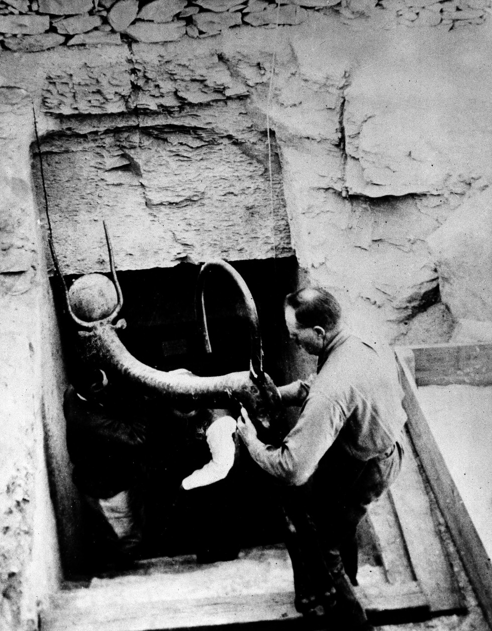 Workmen remove an object from  the tomb of King Tut in the Valley of the Kings, Luxor, Egypt, Feb. 1923.  (AP Photo)