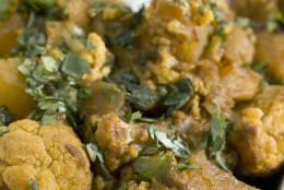 This Oct. 3, 2010 photo shows spiced cauliflower and potatoes. This easy to make dish can be served with naan, an oven-baked flatbread.   (AP Photo/Larry Crowe)