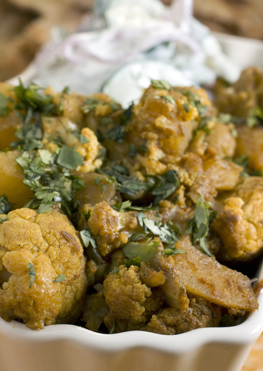 This Oct. 3, 2010 photo shows spiced cauliflower and potatoes. This easy to make dish can be served with naan, an oven-baked flatbread.   (AP Photo/Larry Crowe)