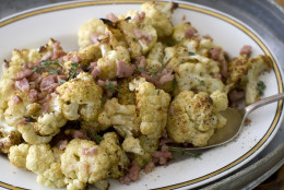 This Nov. 21, 2011 photo shows Elizabeth Karmel's recipe for roasted cauliflower florets in Concord, N.H. Roasting has the power to transform just about any food, but this effortless cooking technique is most dramatic when applied to winter vegetables.    (AP Photo/Matthew Mead)