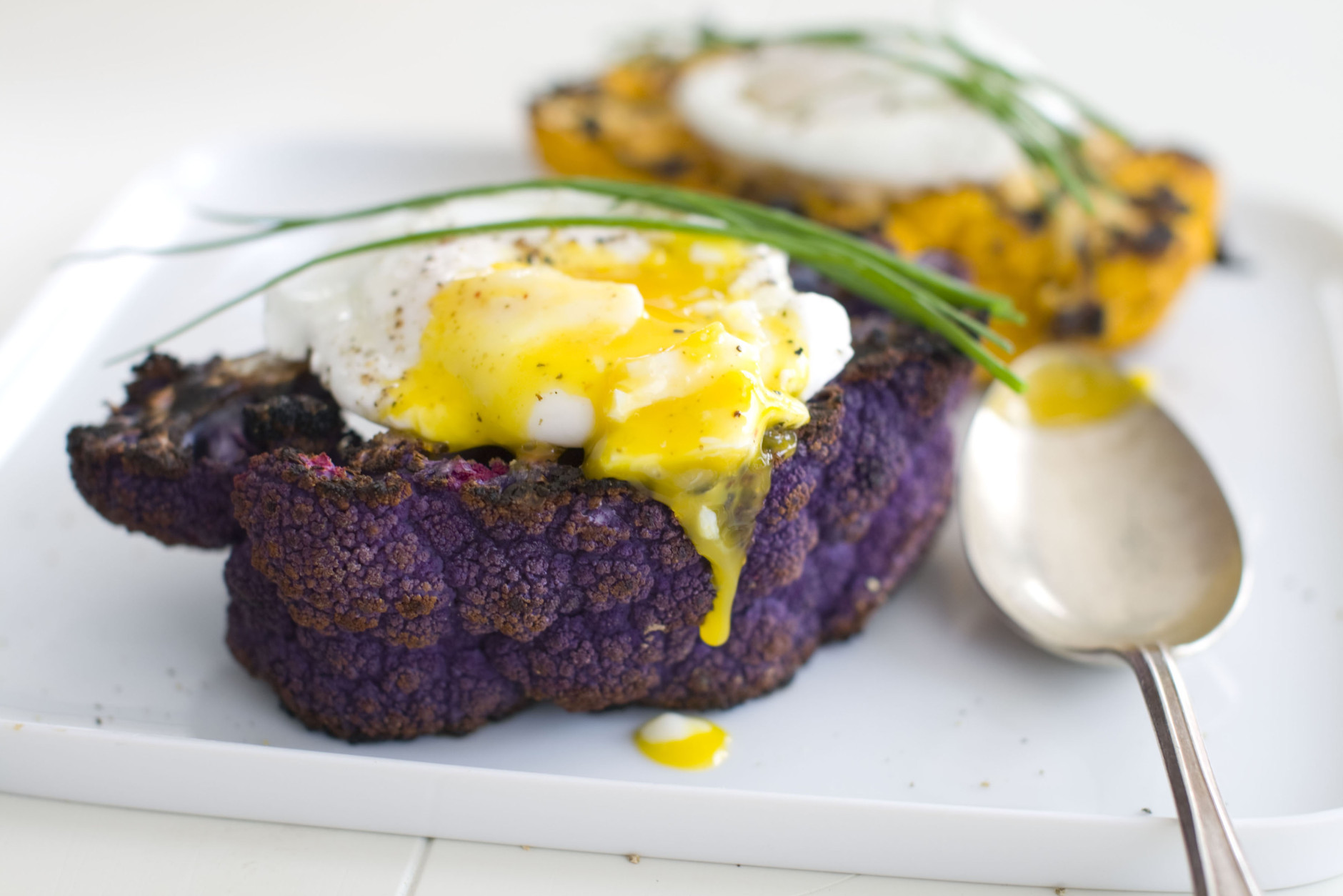 A purple cauliflower with poached eggs and truffle oil is shown. (AP Photo/Matthew Mead)