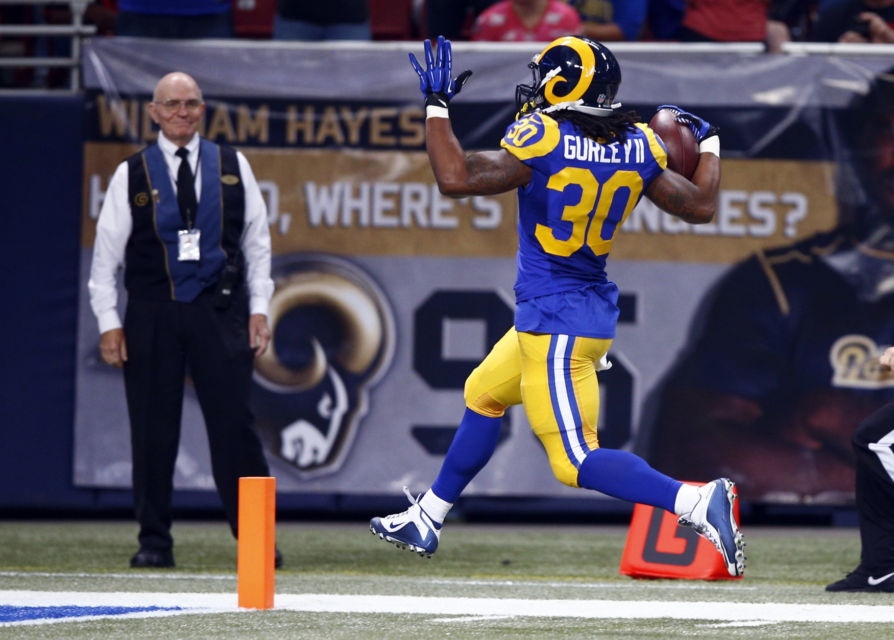 St. Louis Rams running back Todd Gurley scores on a 71-yard run during the second quarter of an NFL football game against the San Francisco 49ers, Sunday, Nov. 1, 2015, in St. Louis. (AP Photo/Billy Hurst)