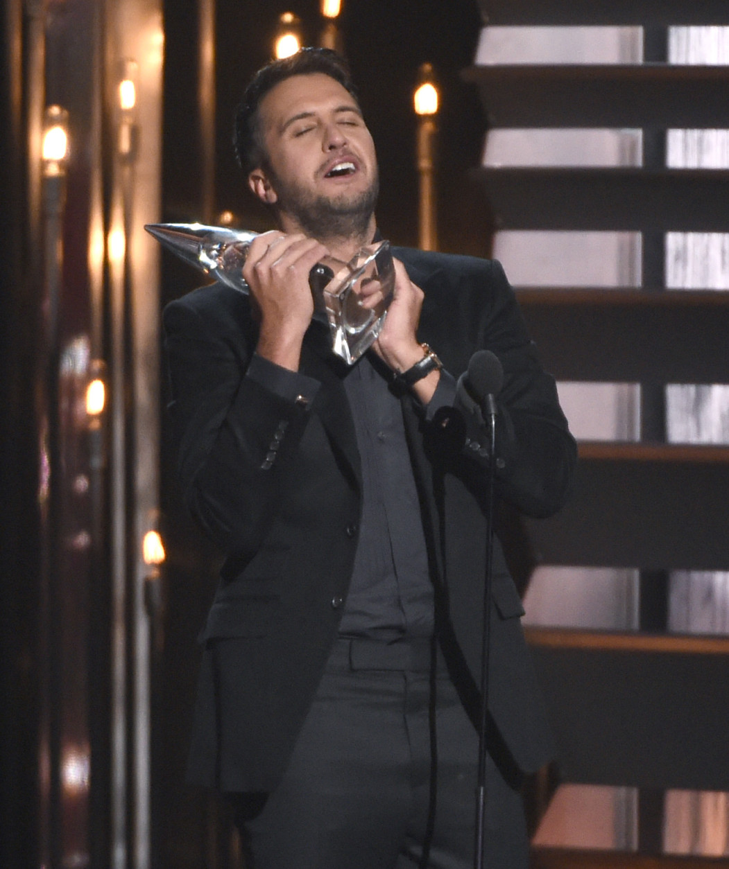 Luke Bryan accepts the award for entertainer of the year at the 49th annual CMA Awards at the Bridgestone Arena on Wednesday, Nov. 4, 2015, in Nashville, Tenn. (Photo by Chris Pizzello/Invision/AP)