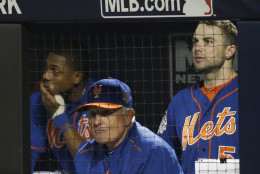 New York Mets manager Terry Collins watches with David Wright, right, the 11th inning of Game 5 of the Major League Baseball World Series against the Kansas City Royals Sunday, Nov. 1, 2015, in New York. (AP Photo/Matt Slocum)