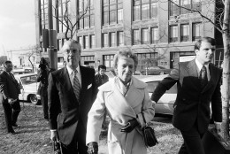 President Richard Nixon's secretary Rose Mary Woods walks with her lawyer Charles Rhyne on the way to a court appearance before U.S. District Judge John Sirica, Nov. 26, 1973 in Washington. Miss Woods has delivered testimony before Judge Sirica dealing with White House tapes. (AP Photo/Bob Daugherty)