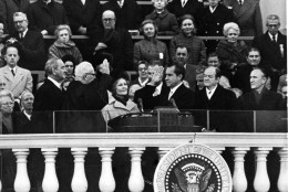 President Richard M. Nixon takes the oath of office from Chief Justice Earl Warren as his wife, Pat Nixon, holds two family bibles on the steps of the U.S. Capitol in Washington, Jan. 20, 1969. Former President Lyndon Johnson is beside Warren while Nixon is flanked by Vice President Spiro Agnew and former Vice President Hubert Humphrey, right. Lady Bird Johnson, the former president's wife is at extreme left, and Agnew's wife Judy is beside her. Sen. Mike Mansfield is at right. (AP Photo)