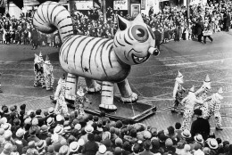 An outdoor float of a big cat makes its way down a street during the Thanksgiving Day Parade in New York City on Nov. 26, 1931.  (AP Photo)