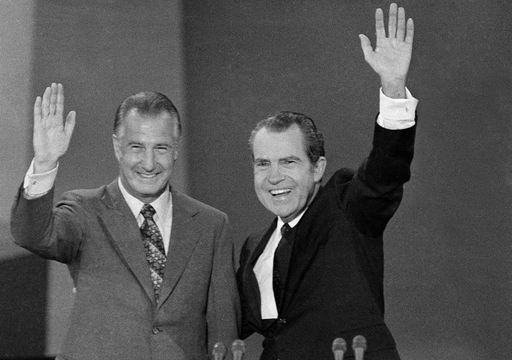 U.S. President Richard M. Nixon, right, and Vice-president Spiro T. Agnew wave to the Republican National Convention delegates in Miami, Fla., Aug. 23, 1972, who nominated them to run for re-election. (AP Photo)