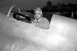 Howard Hughes, industrialist, film producer and pilot, poses in the cockpit of his new racing plane after a test flight in Los Angeles August 17, 1935.  The plane, nearly two years in construction at a cost believed to be more than $100,000, was to be piloted by Hughes in the Bendix race from Los Angeles to Cleveland. (AP Photo)