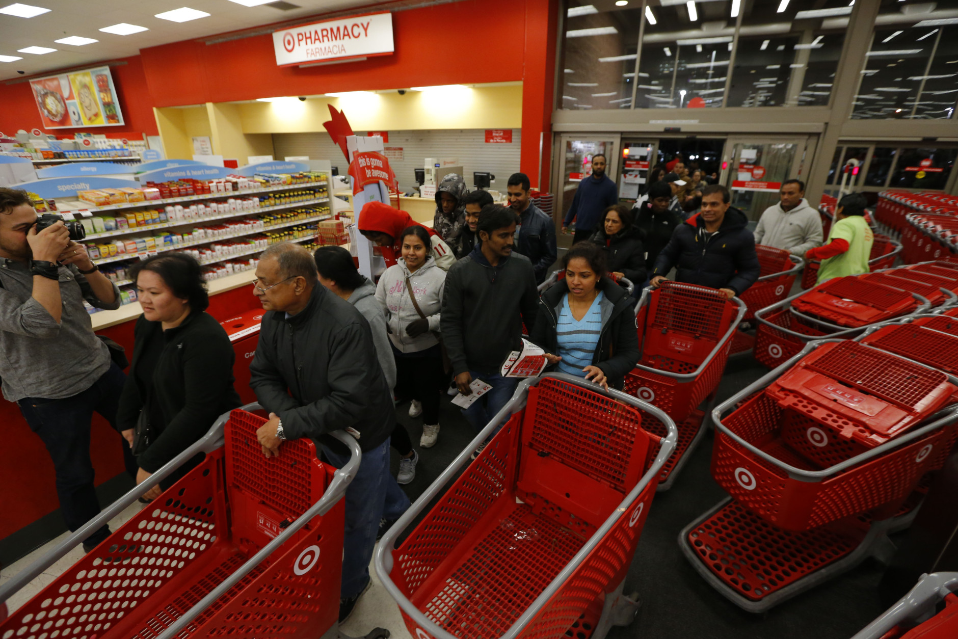IMAGE DISTRIBUTED FOR TARGET - Guests enter Target's Jersey City, N.J. store at 6 p.m. Thursday, Nov. 26, 2015. (Noah K. Murray/AP Images for Target)
