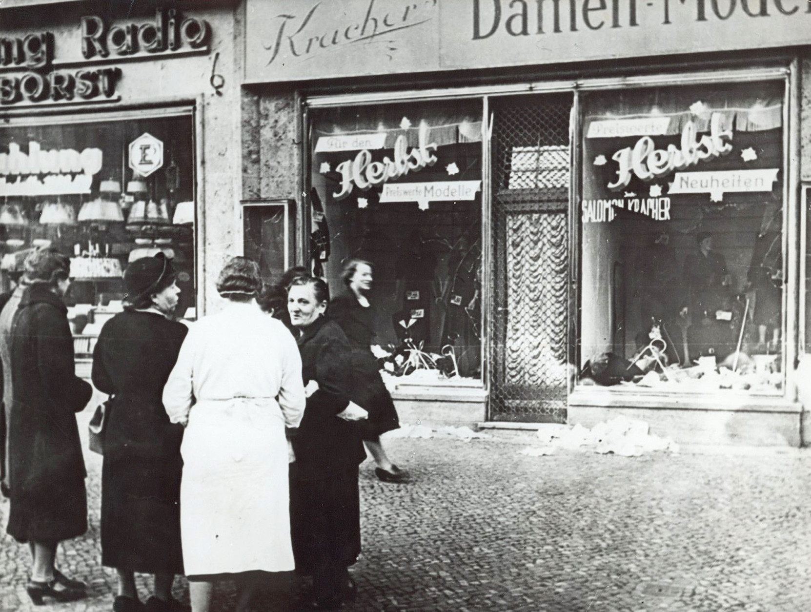 A group of people stand outside a Jewish-owned shop in an unnamed German town in November 1938, after the Kristallnacht, when Nazis thugs burned and plundered hundreds of Jewish homes, shops and synagogues across the country. November 9th is regarded a historic faithful day in Germany as on the same day in 1918 monarchy in Germany was overthrown, in 1939 it heralded the Holocaust and in 1989 it marked the fall of the Berlin Wall which resulted in the German reunification after 28 years of division. (AP Photos)