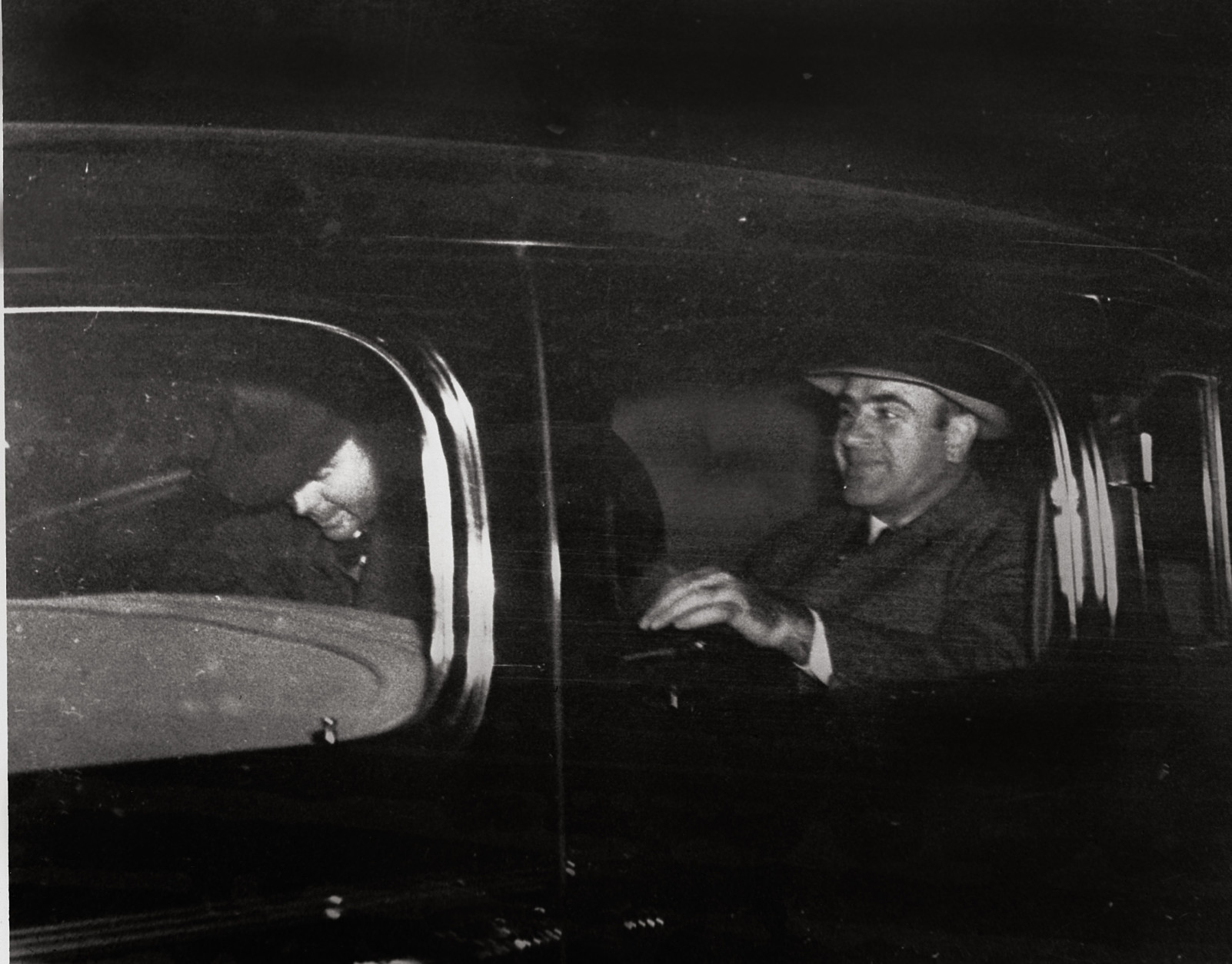 Al Capone, right, Chicago's infamous gang overlord during prohibition, leaves Harrisburg, Pa., on Nov. 16, 1939 with a federal officer for Lewisburg, Pa., where he was released after spending seven years in prison in Atlanta and San Francisco's Alcatraz.   (AP Photo)