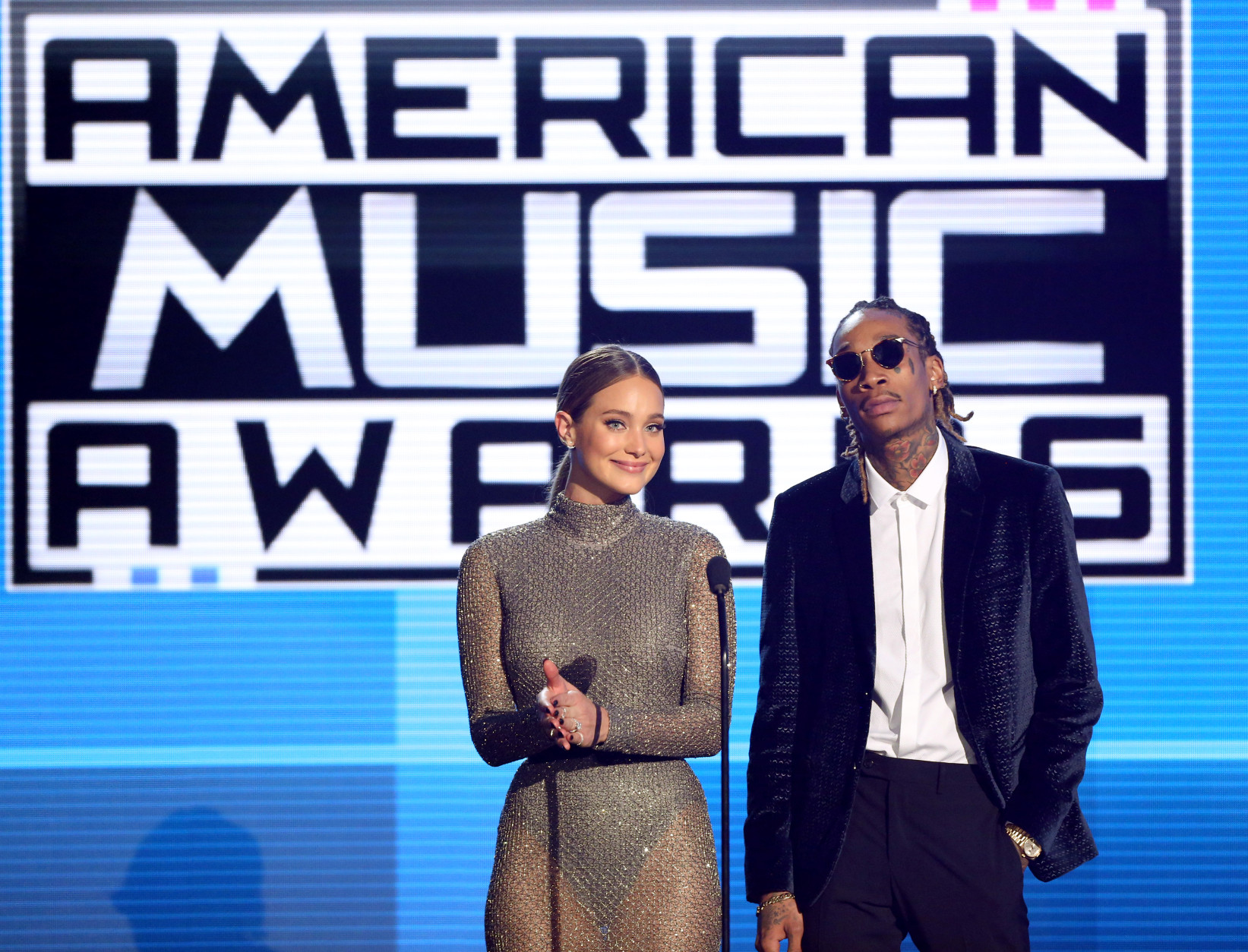 Hannah Davis, left, and Wiz Khalifa introduce a performance by 5 Seconds of Summer at the American Music Awards at the Microsoft Theater on Sunday, Nov. 22, 2015, in Los Angeles. (Photo by Matt Sayles/Invision/AP)