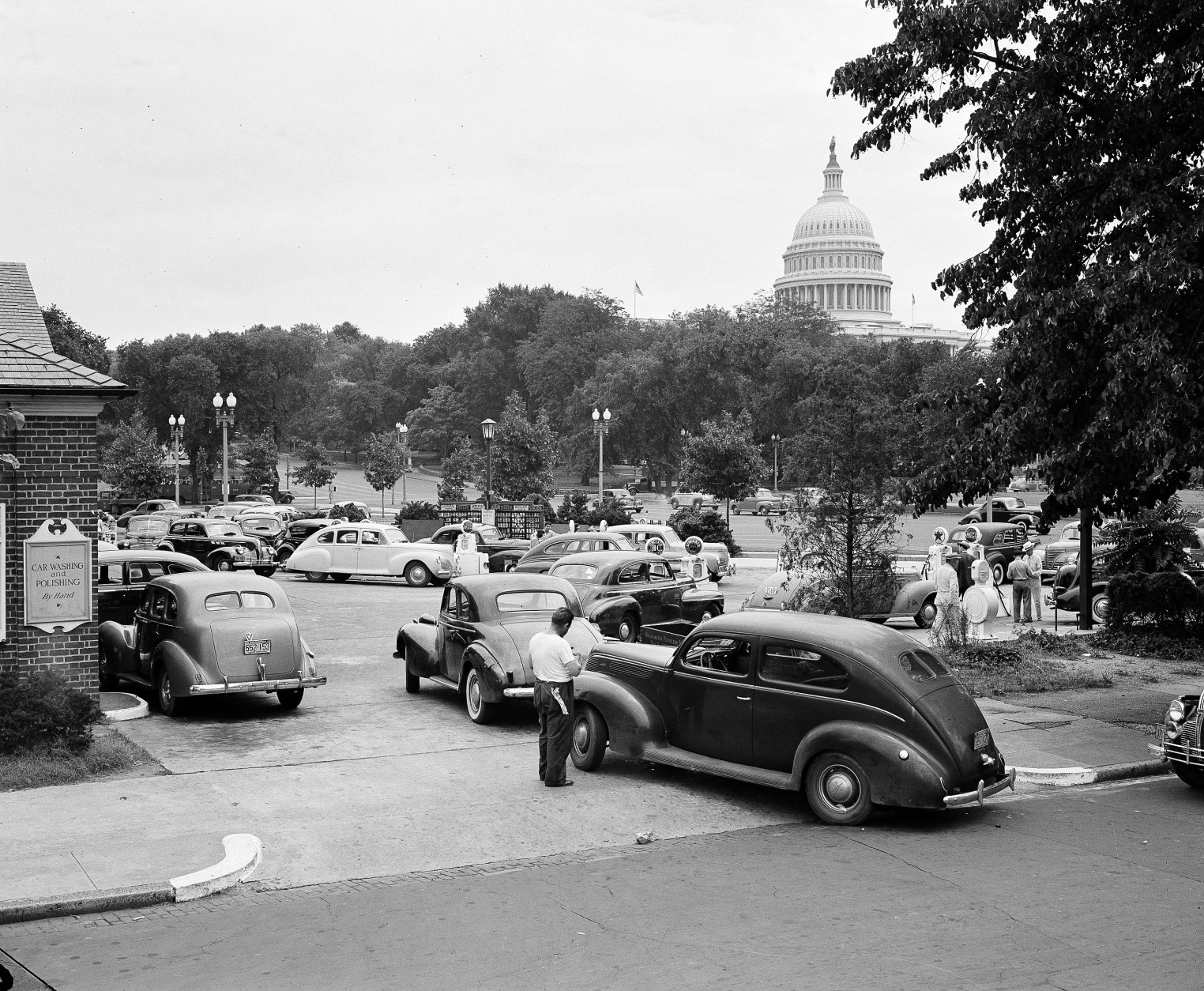 A long line of cars waiting to get the last gasoline on their temporary gas rationing cards is seen near the Capitol, July 21, 1942, in Washington.  (AP Photo)