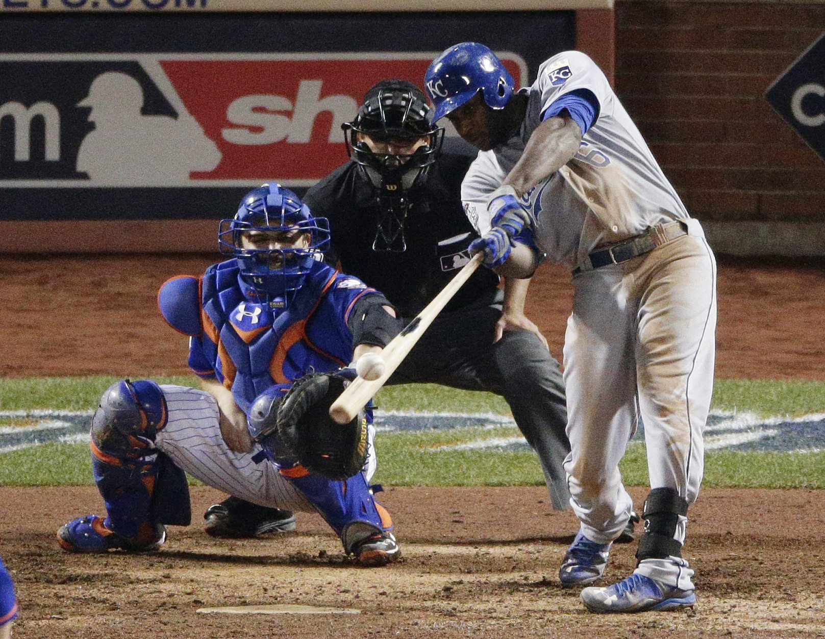 Kansas City Royals' Lorenzo Cain hits a three run double against the New York Mets during the 12th inning of Game 5 of the Major League Baseball World Series Monday, Nov. 2, 2015, in New York. (AP Photo/Charlie Riedel)