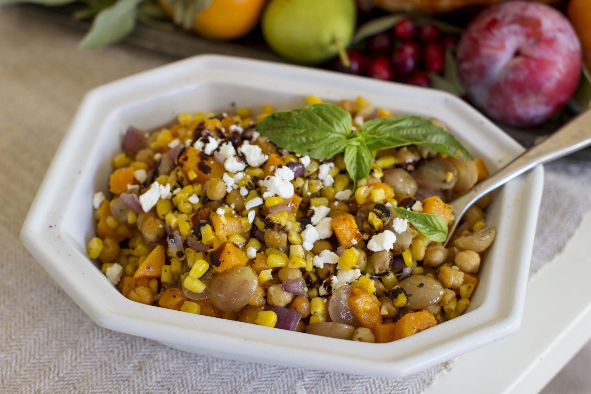 This Oct. 27, 2014, photo shows roasted grape succotash in Concord, N.H. This dish of roasted vegetables starts with classics, onion, butternut squash and corn, but mixes it up with a can of chickpeas and halved red grapes. (AP Photo/Matthew Mead)