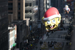 The Sponge Bob Square Pants balloon goes down 6th Avenue for the 89th annual Macy's Thanksgiving Day Parade as seen from above street level on Thursday, Nov. 26, 2015, in New York. (Photo by Ben Hider/Invision/AP)