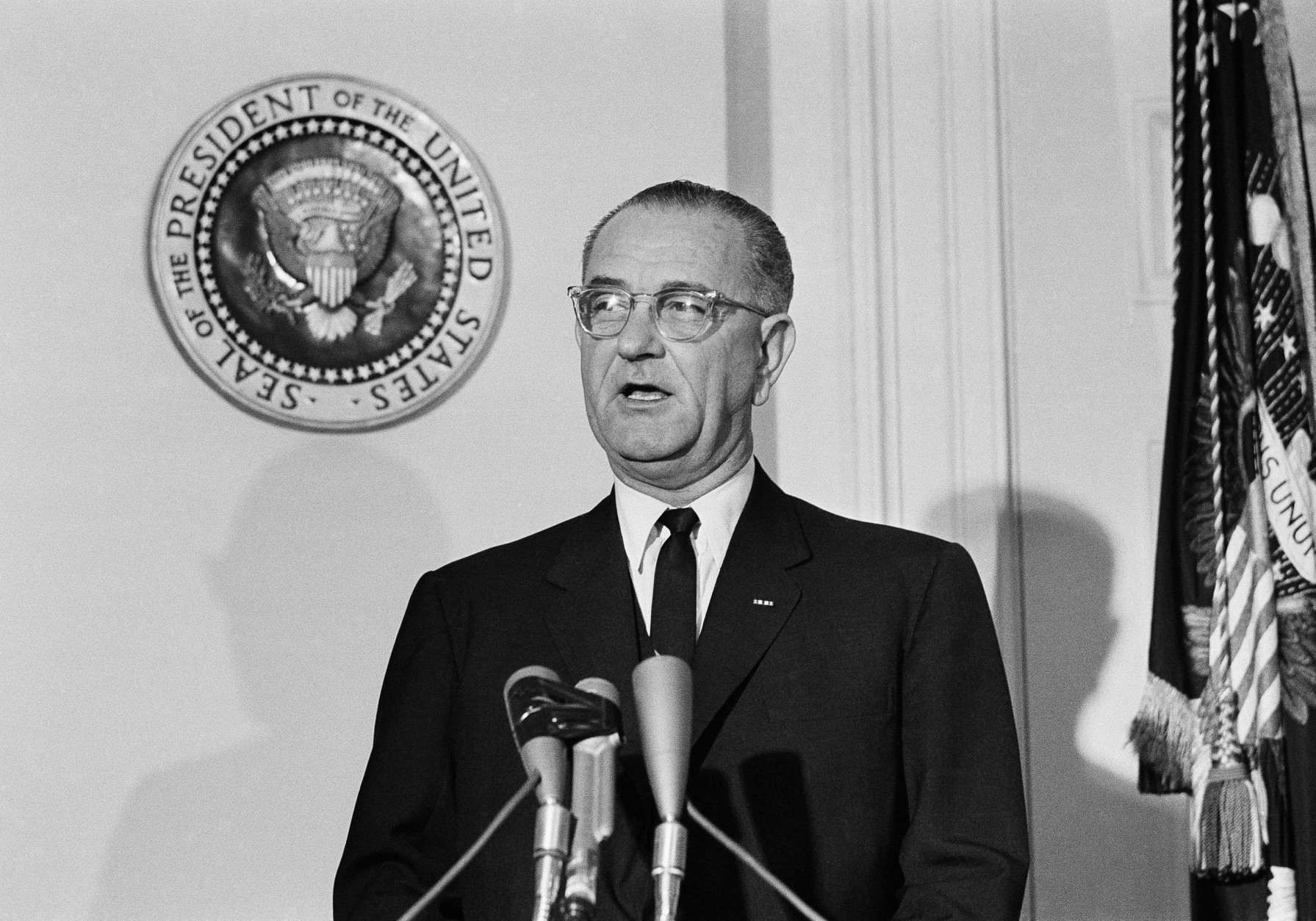 U.S. President  Lyndon Johnson makes his first formal address to the American people as their new chief executive, speaking from the Fish Room in the White House November 23, 1963 over a television-hookup.   Johnson proclaimed Monday as a day of mourning for the assassinated President John F. Kennedy.   The seal of the President of the United States is at left. (AP Photo)