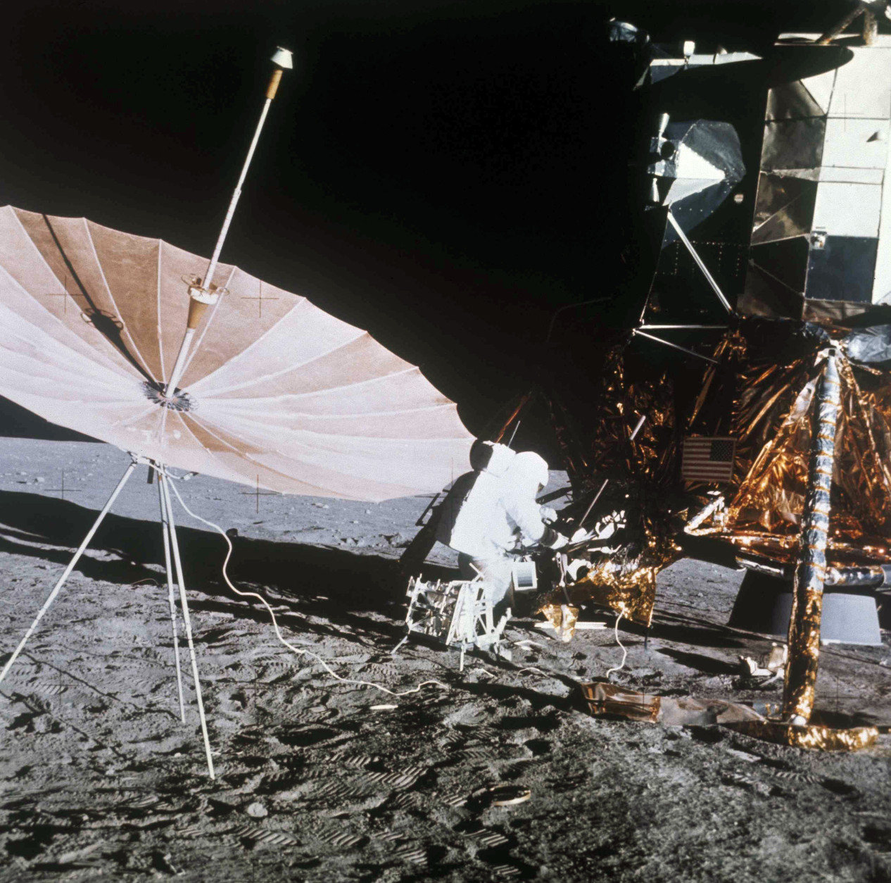 Astronaut of Apollo 12 is shown with equipment on the surface of the moon, Nov. 19, 1969.  (AP Photo)