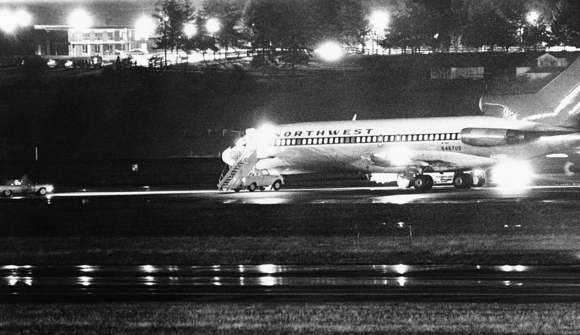 FILE -- A hijacked Northwest Airlines jetliner is seen in this Nov. 25, 1971 file photo as it sits on a runway for refueling at Seattle-Tacoma International Airport, Nov. 25, 1971, Seattle. 2011 has been a rich year for students of D.B. Cooper, the mysterious skyjacker who vanished out the back of the Boeing 727 wearing a business suit, a parachute and a pack with $200,000 in ransom money 40 years ago Thursday. (AP Photo, File)